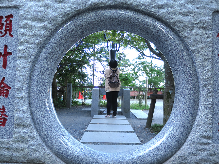 Duck through the hole and pray at this sub-shrine for good heath, then ring the bell.