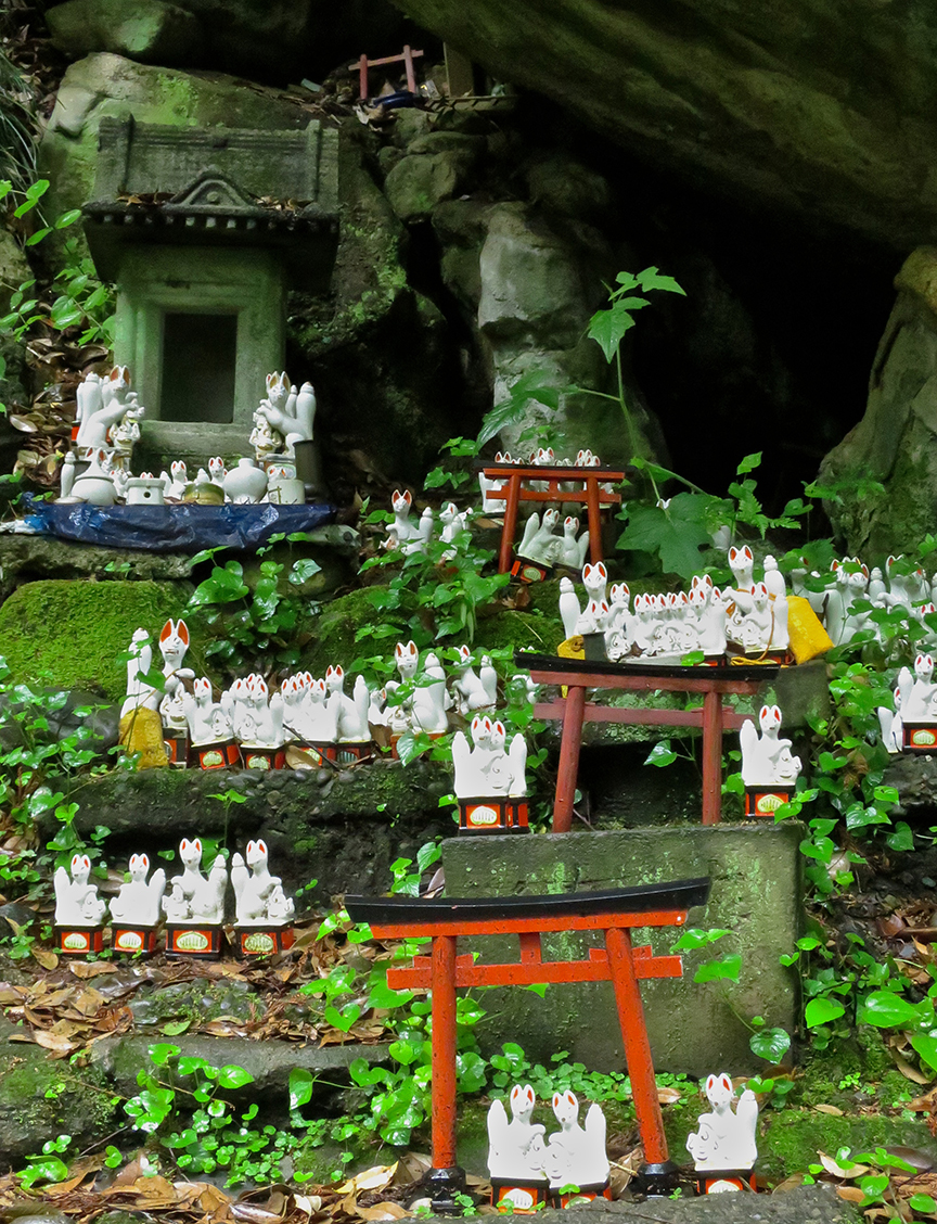 As you climb the path to the various sub-shrines, you pass little villages populated by lucky fox figures left there by pilgrims.