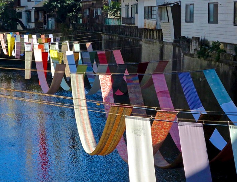 Kimono fabric draped along canal in Nakai at some-no-komichi festival